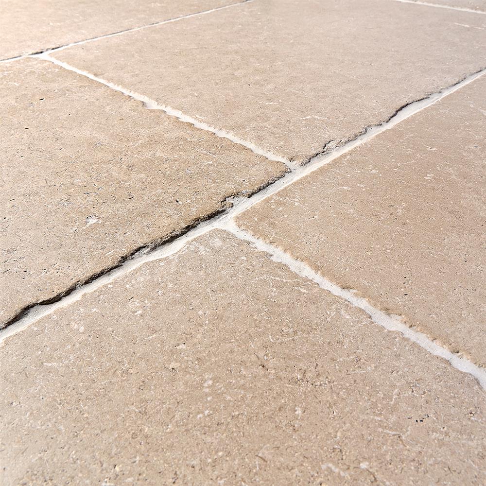 Close-in detail of antiqued limestone tiles
